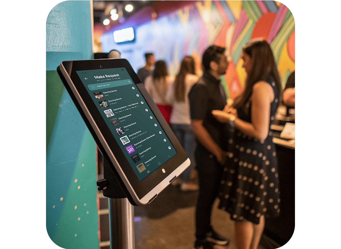 A tablet running Rekwest in kiosk mode at a karaoke venue for singers to request songs